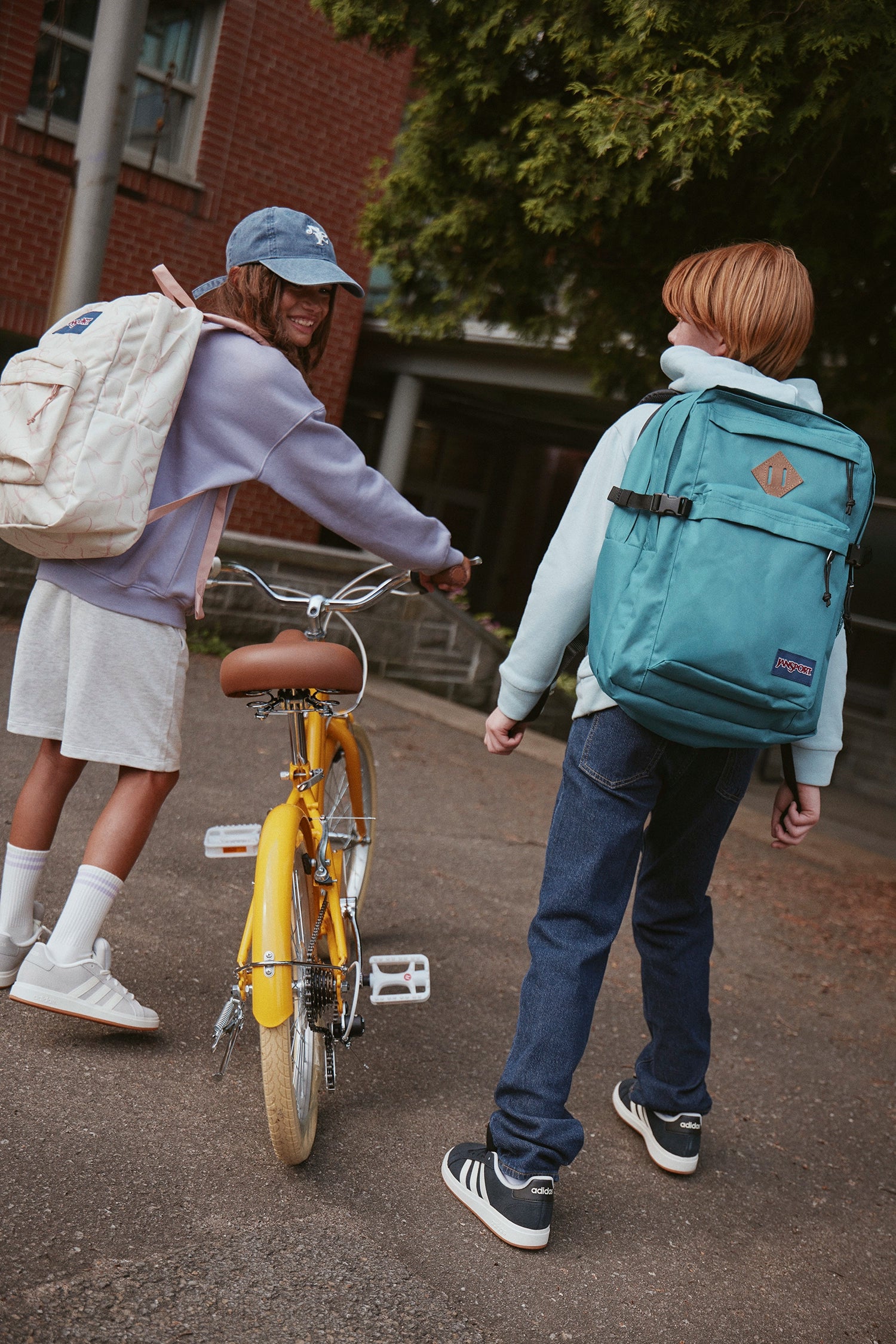 kids_jansport_bike_walking.webp